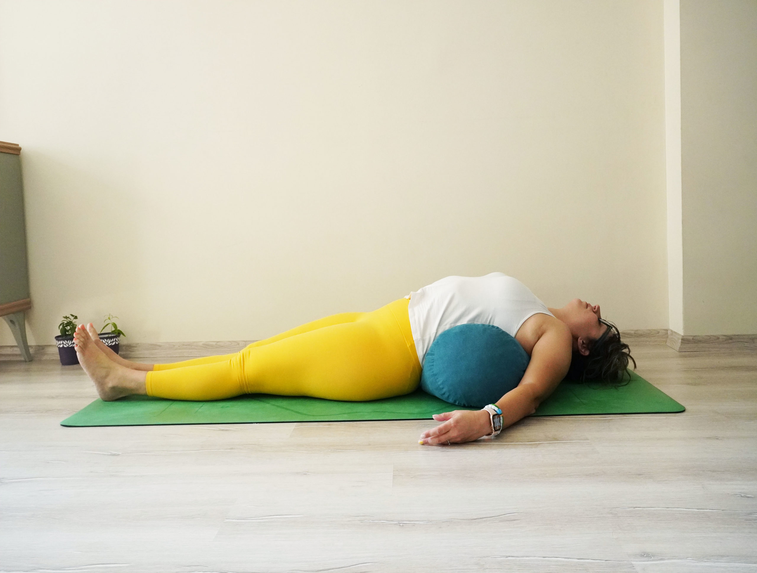 6 Ways Using a Bolster in Yoga Encourages Health Yoga