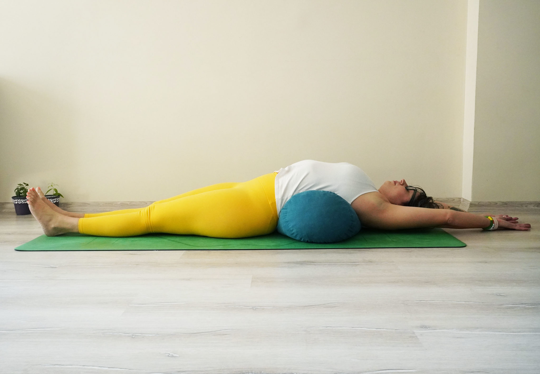 6 Ways Using a Bolster in Yoga Encourages Health Yoga