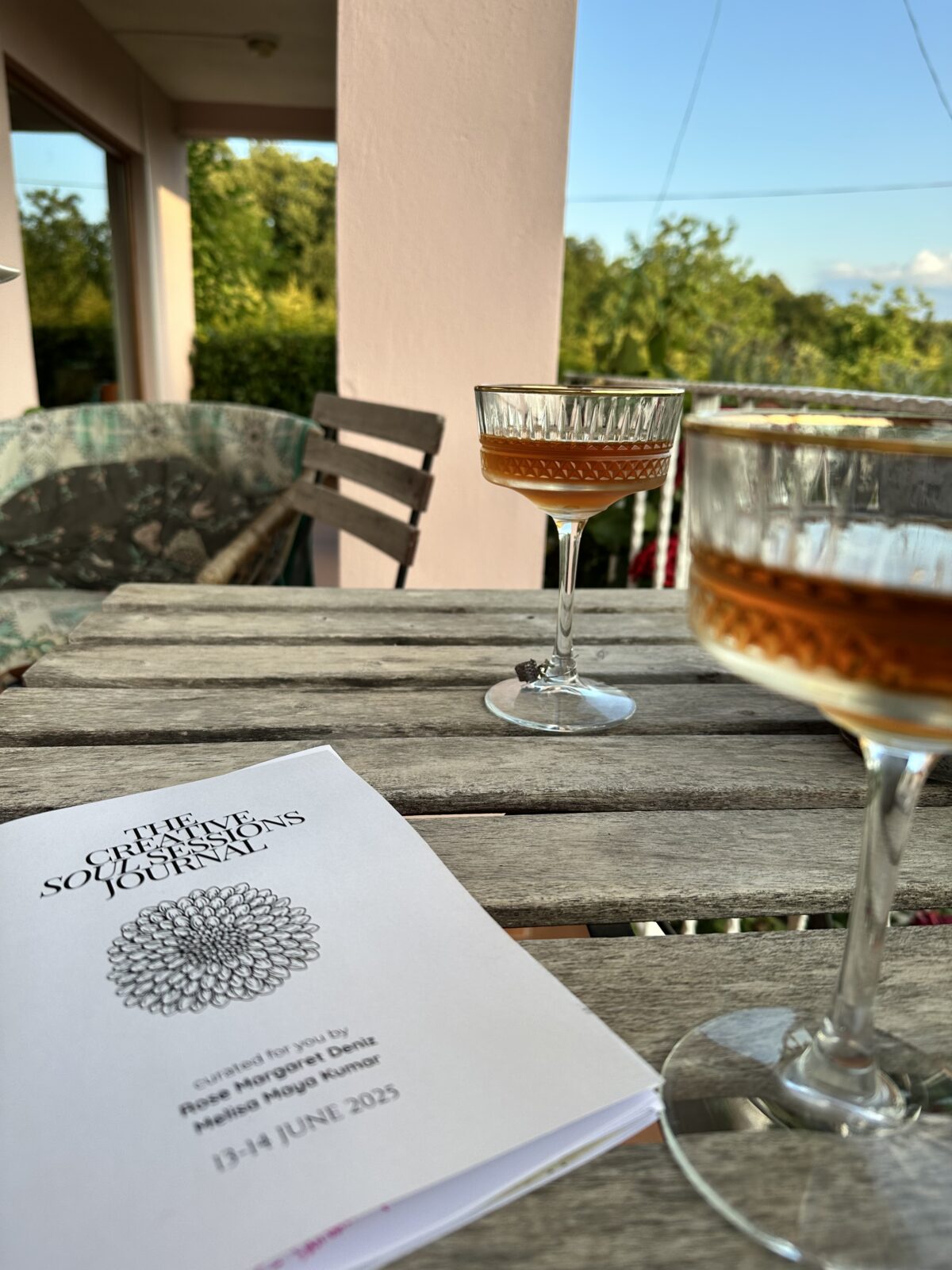 The Creative Soul Sessions journal and a sweet honey beverage near sunset